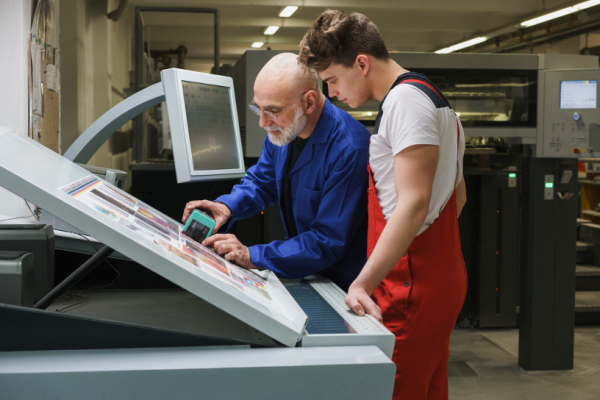 Operators checking color of printed material