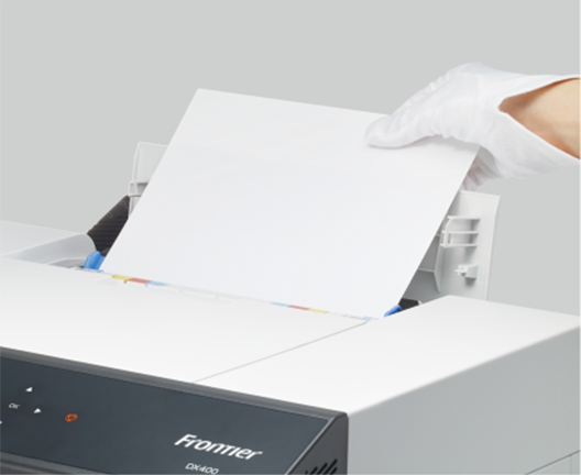 Inkjet Paper is loaded into the paper feed unit.