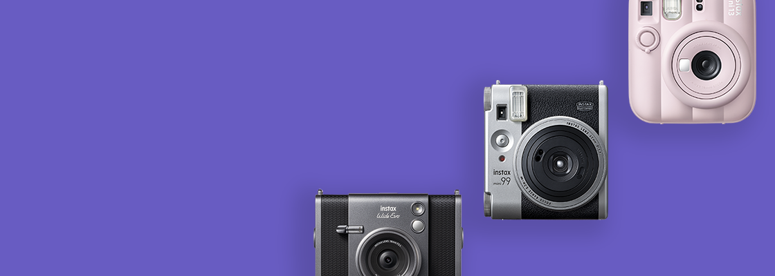 [photo] 3 instax™ cameras in different colors over a purple background