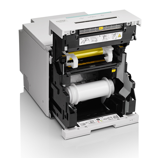 [photo] Printer open showing ribbon and empty roll of paper