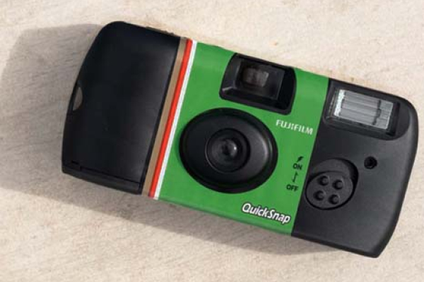 quicksnap camera lying on a stone slab