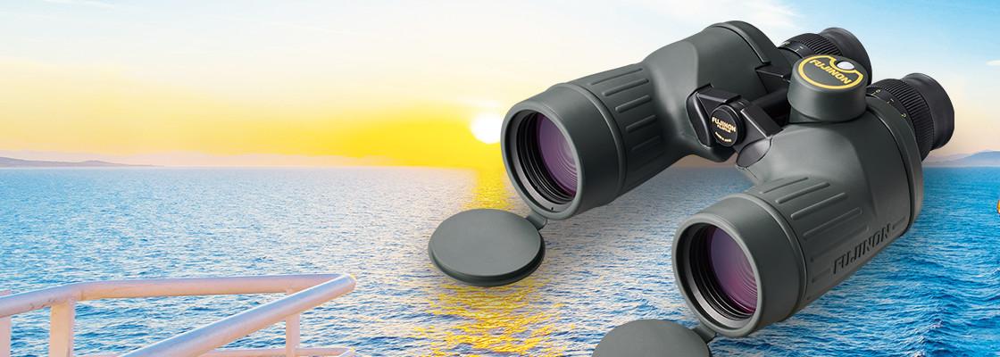 [photo] FMT Series Binoculars with a sun setting over the ocean background