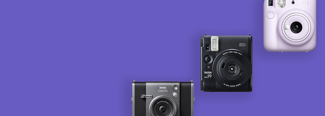 [photo] 3 instax™ cameras in different colors over a purple background
