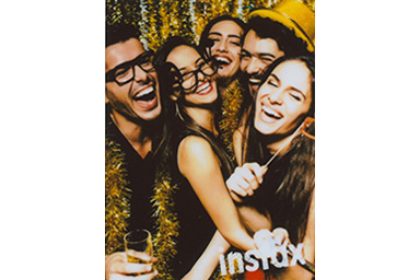 [photo] Instax frame added to a photo of smiling young adults taking a photo in a photo booth