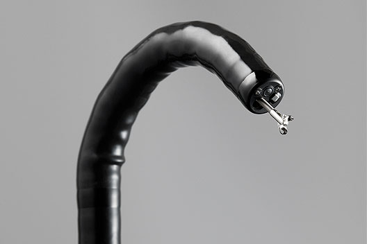 [photo] Flexible tip of scope bent downward with forceps sticking out