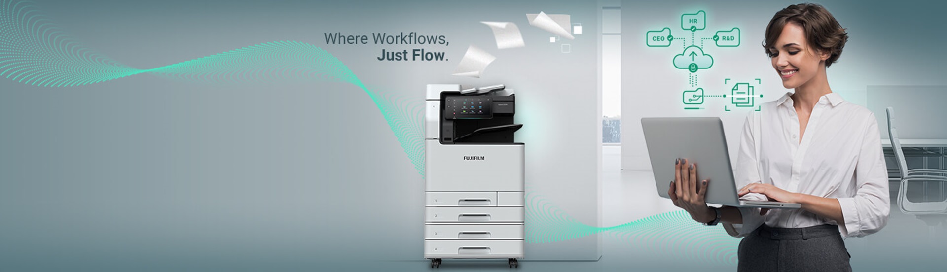 A businessperson using a laptop near a latest multifunction printer. In the background, icons representing the cloud and network are floating, symbolizing a futuristic office environment and seamless workflow.