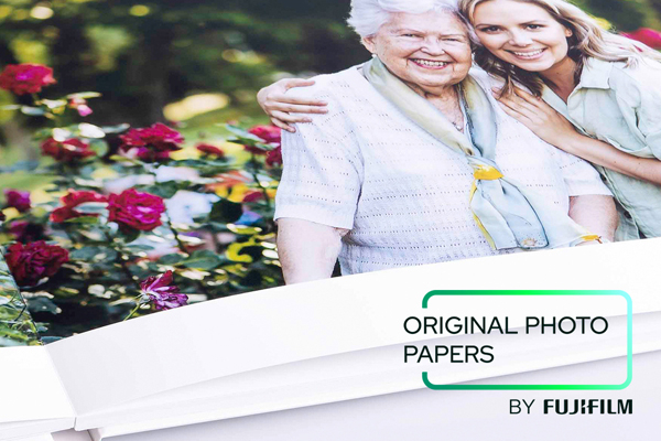 Logo for Fujifilm original photopaper, in the background a young women embracing an elder women