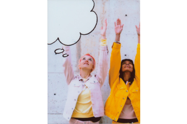 [photo] Speech Bubble 3 frame added to a photo of two female friends with arms stretched out upwards