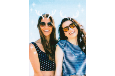 [photo] Antlers frames applied to a photo of 2 female friends in sunglasses smiling at the camera