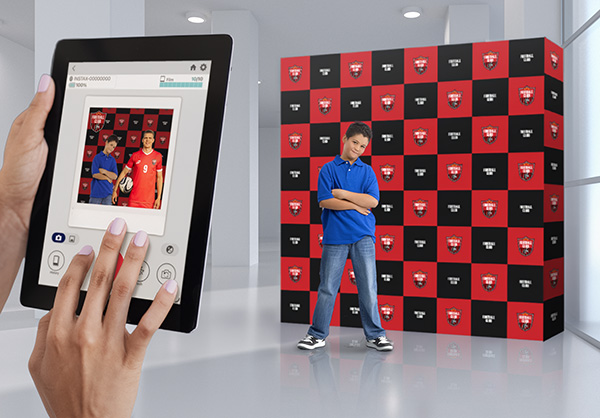 A user taking a photo with the instax Biz™ app using a custom template created in instax Biz™ Template Maker.