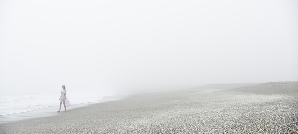 [photo] A wide shot of a lady walking on the beach