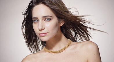 [photo] Medium view shot of a model with flowing hair looking directly at the camera