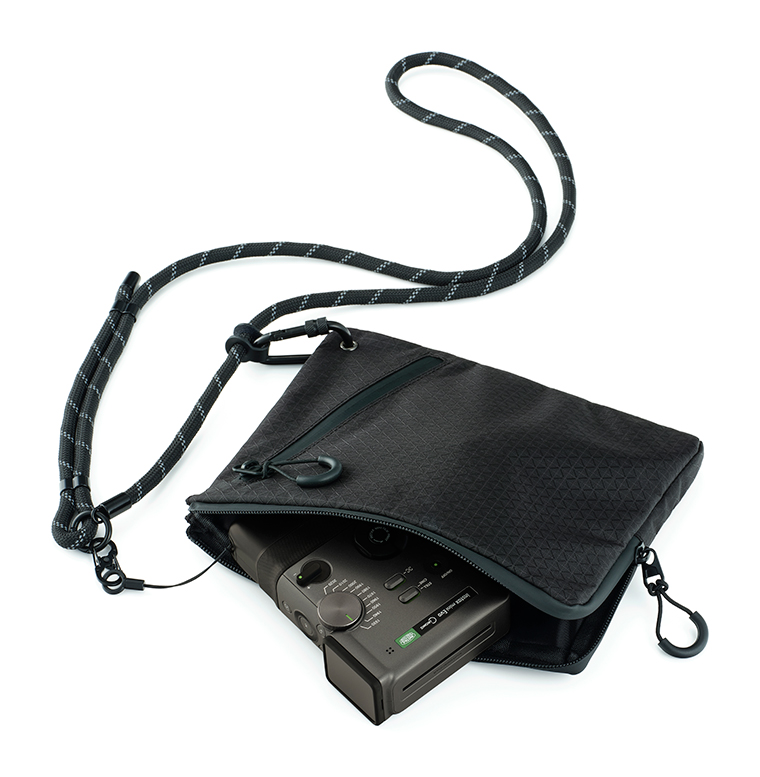 The “instax mini Evo Cinema™” inside its Camera Case