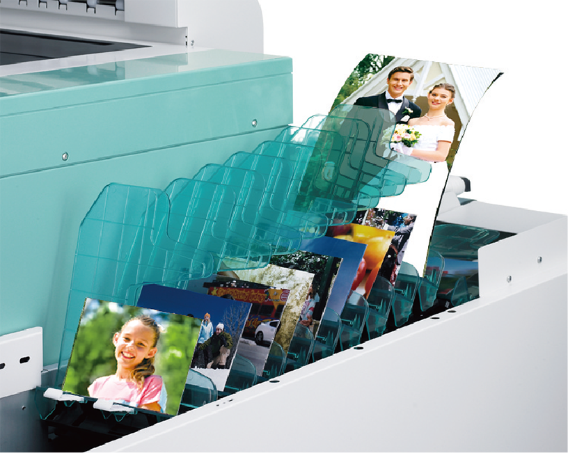 [photo] Print and photo organizing tray, full of various photos, attached to DL600 printer