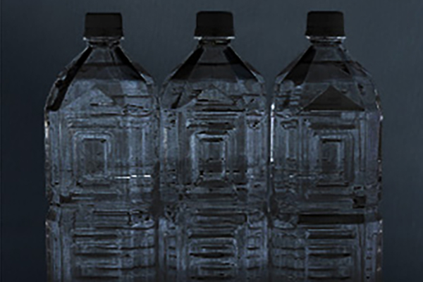 [photo] Three large, clear bottles of water next to each other in front of dark grey background