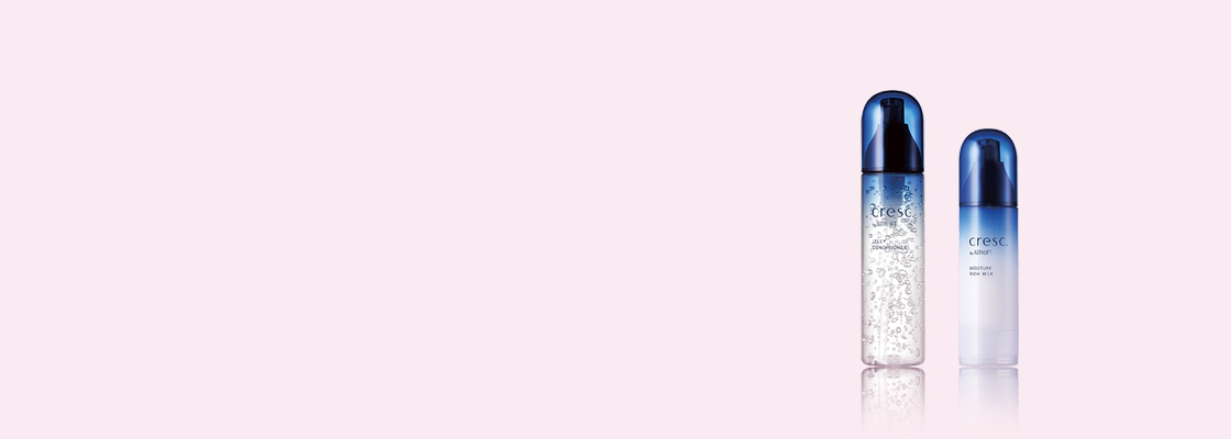 Two cresc. by Astalift products side by side on pink background.