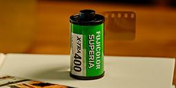 [photo] Fujicolor Superia X-Tra 400 film on a white table book and sample print out