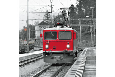 Image of a red train with Red Partial filter applied where everything except the train are black and white