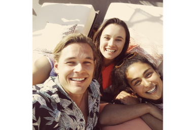 Image of three persons with Amber filter applied