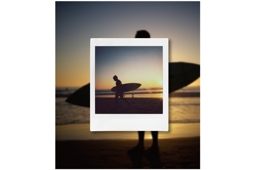 Image of a person with surfboard at the beach with INSTAX photo of a person with surfboard at the beach in front