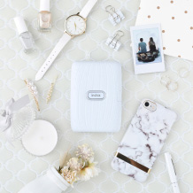image of white mini link printer and other items on the table