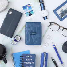 image of blue mini link printer and other items on the table