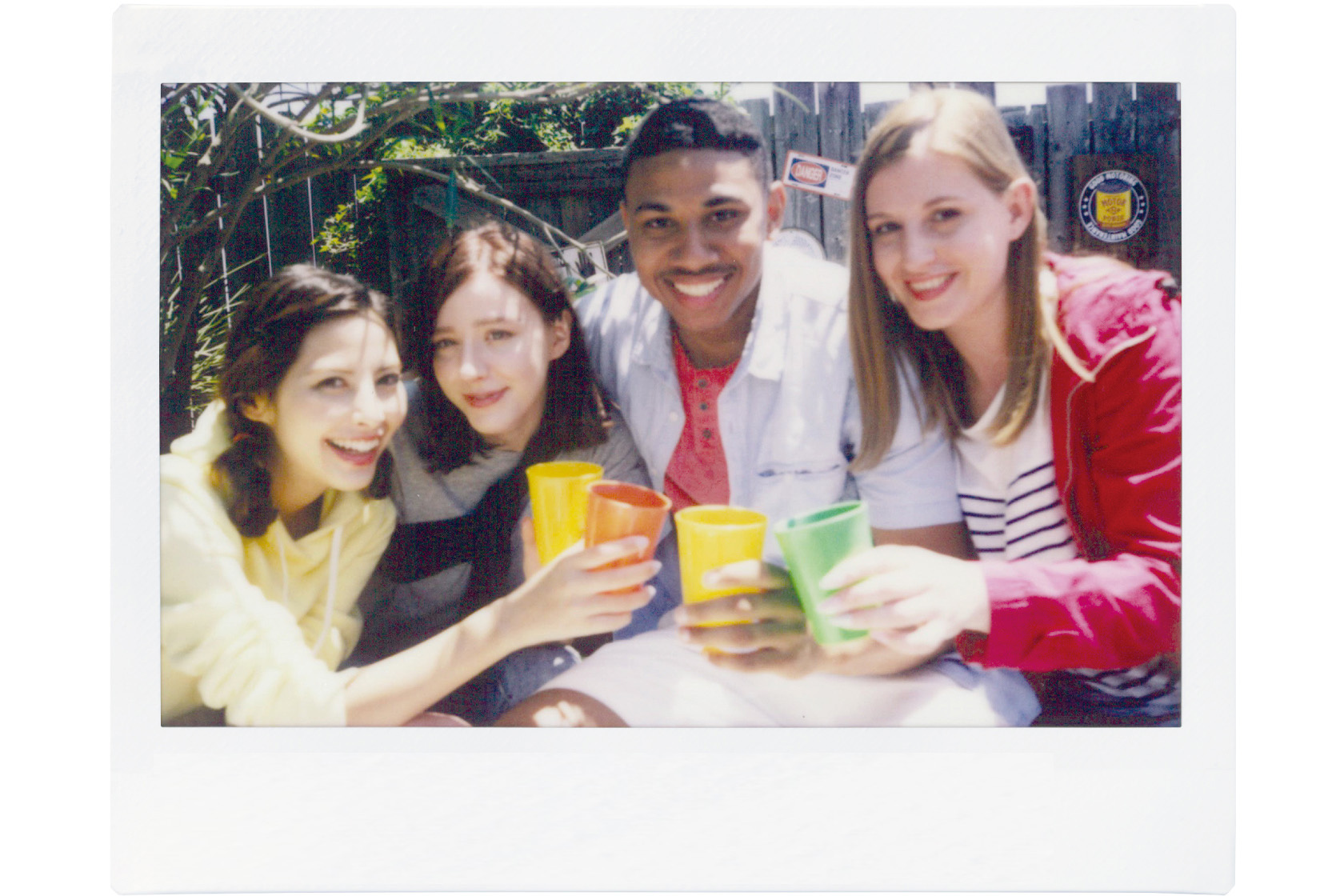 Image of a photo of four friends at outdoor party