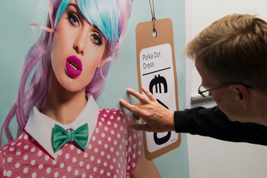 Image of a young woman and price tag on the poster