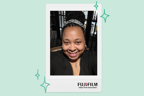 a woman takes a picture of herself from a chair