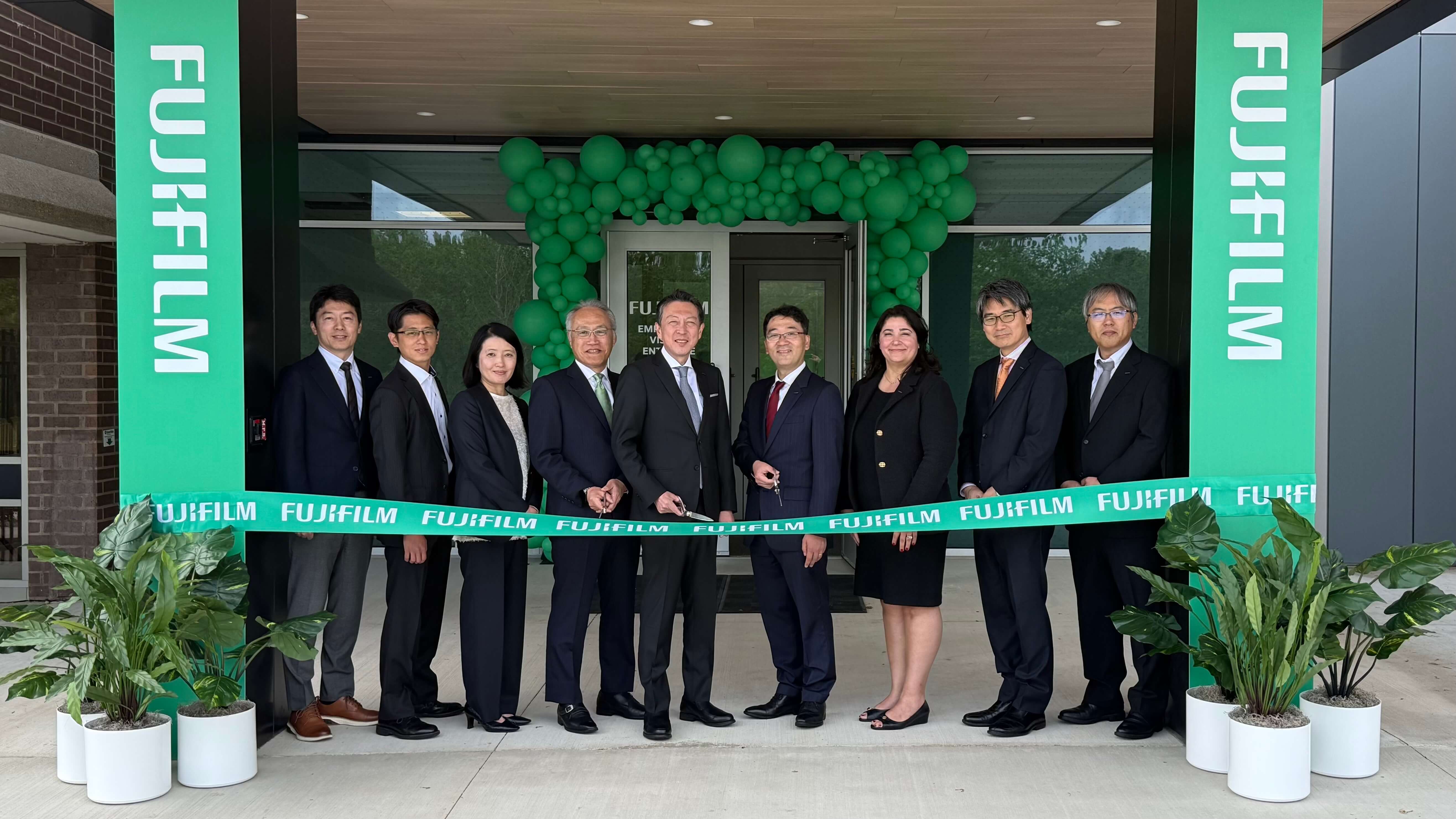 ribbon cutting in front of the new building