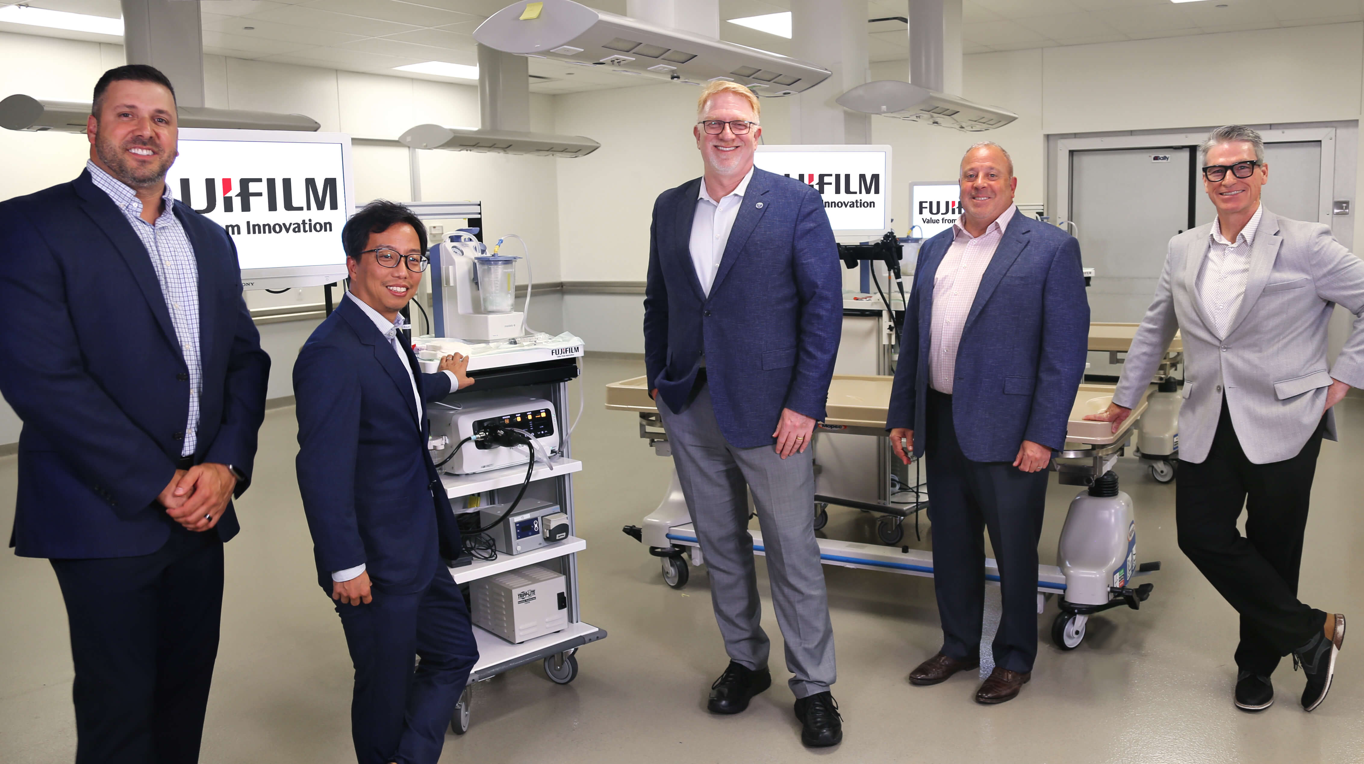 Fujifilm and ASGE leadership in front of medical equipment