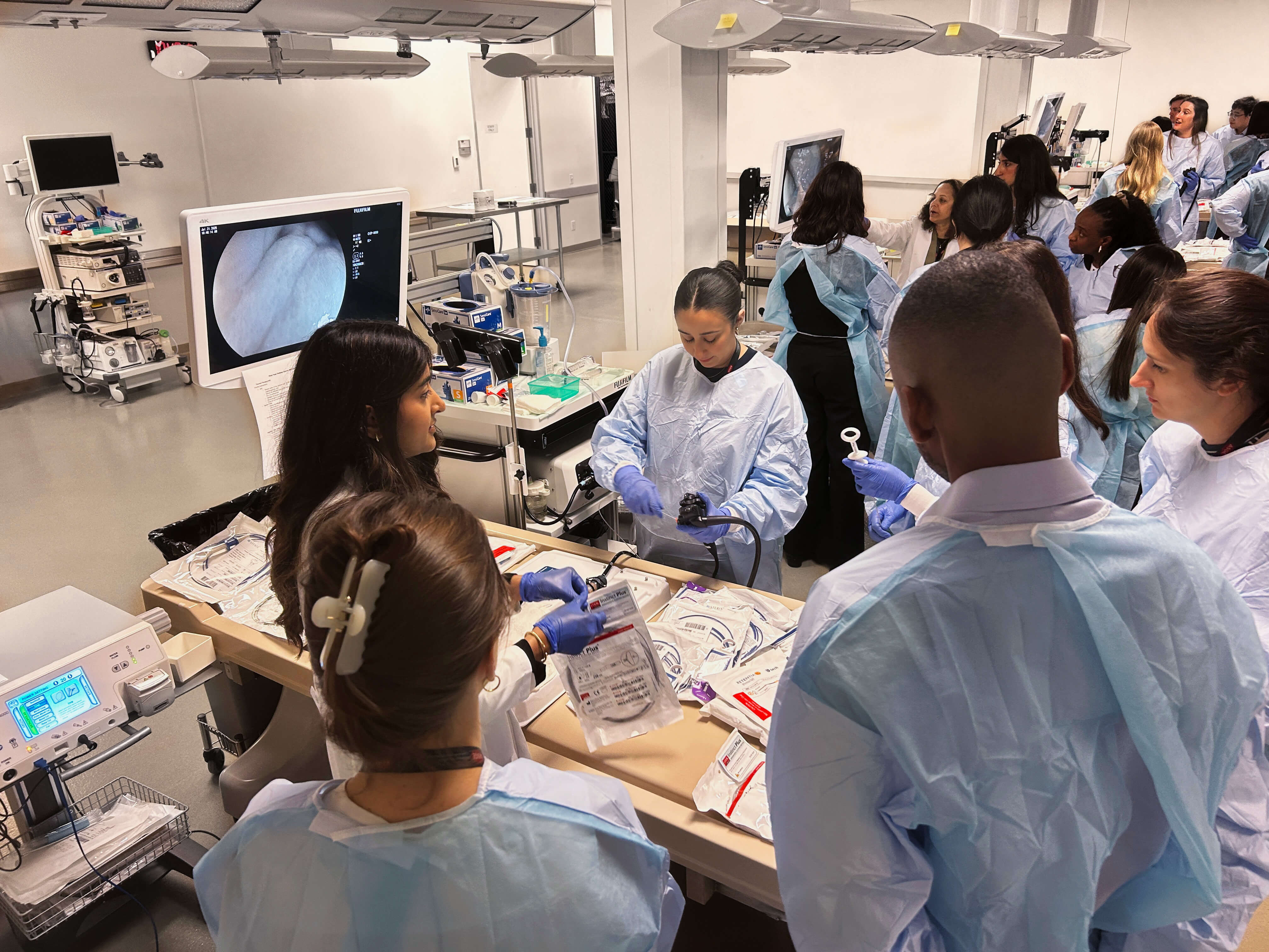 A group of medical professionals use endoscopy equipment