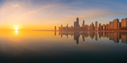 [photo] Sun rising over the horizon with view of city landscape