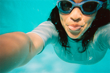 Close-up of a person taking a selfie underwater