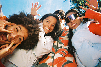 Group of young people posing and smiling
