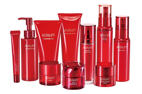 [photo] An assorted collection of ASTALIFT skincare products in red with a white background.