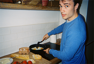 Photo of a man cooking taken with “QuickSnap™”